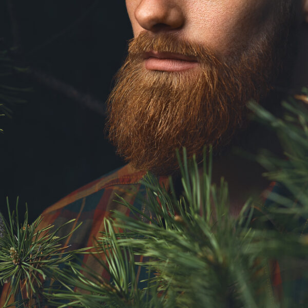 red,beard,close up,shot.,hipster,man,in,the,forest.,brutal