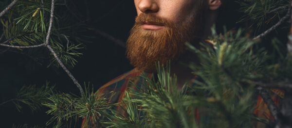 red,beard,close up,shot.,hipster,man,in,the,forest.,brutal