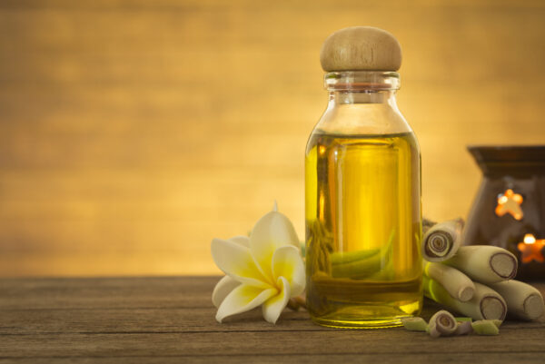 lemon,grass,essential,oils,placed,on,a,wooden,table.,space