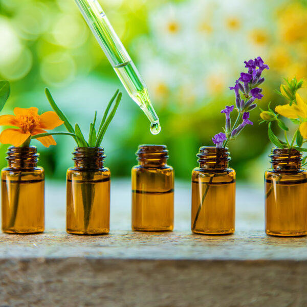 essential,oils,and,herbal,extracts,in,small,bottles.,selective,focus.