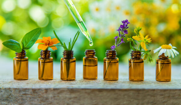 essential,oils,and,herbal,extracts,in,small,bottles.,selective,focus.